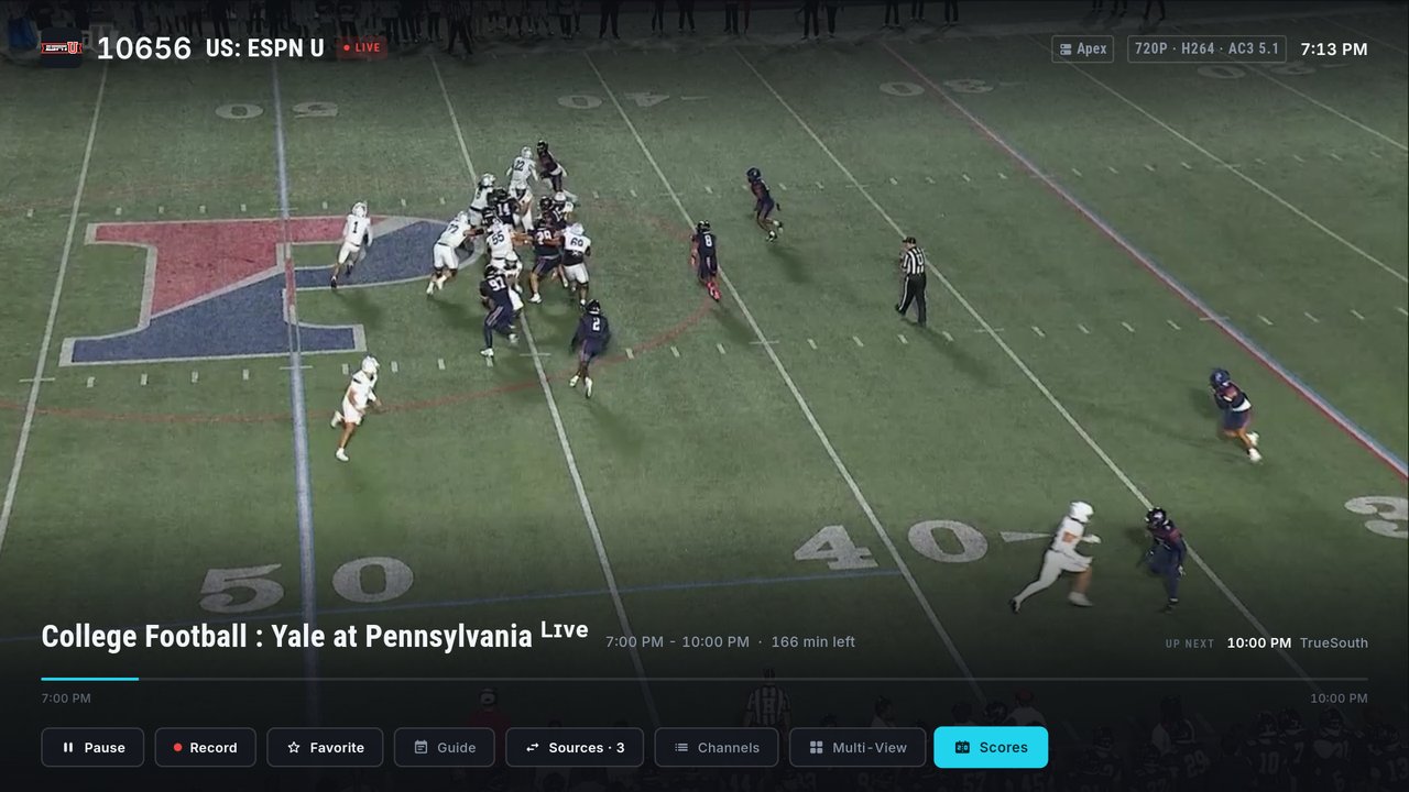 The full-screen player on ESPNU with the control row showing Pause, Record, Favorite, Guide, Sources, Channels, Multi-View, and Scores selected at the end